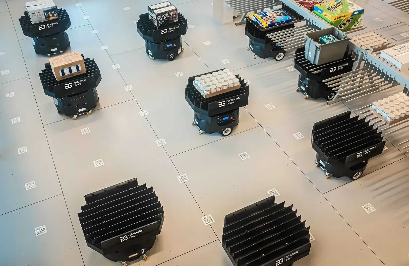 Image of mobile robots carrying items